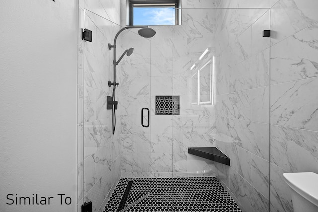 bathroom featuring walk in shower and toilet