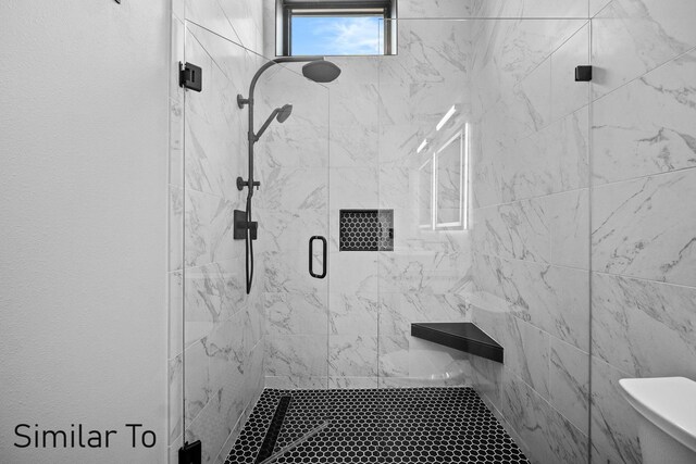 bathroom featuring walk in shower and toilet