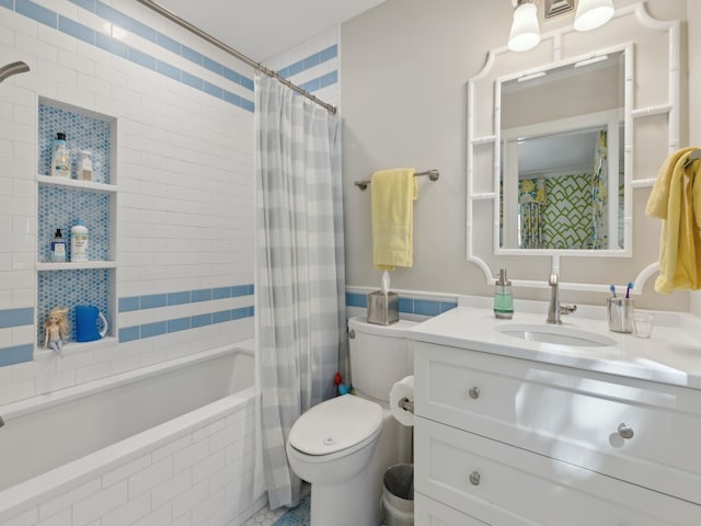 full bathroom with tile patterned flooring, shower / tub combo, vanity, and toilet