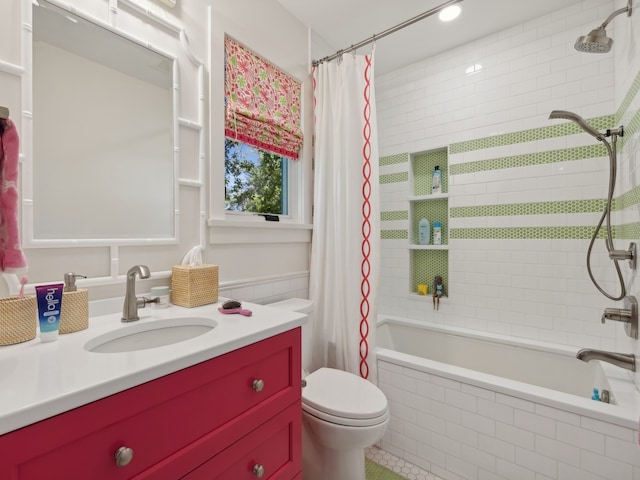 full bathroom featuring shower / tub combo with curtain, vanity, and toilet