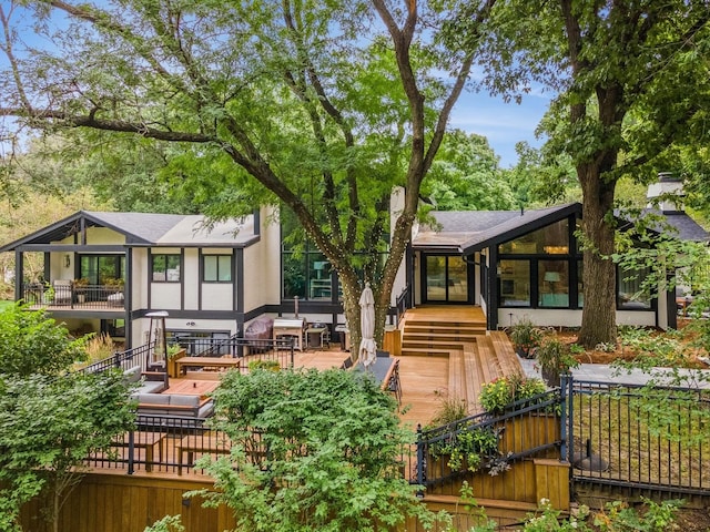 rear view of property with a deck