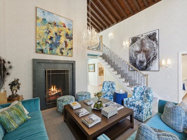 living room with a chandelier, beam ceiling, high vaulted ceiling, and wood ceiling