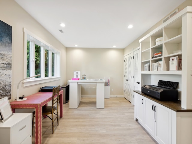 kitchen featuring white cabinetry and light wood-type flooring