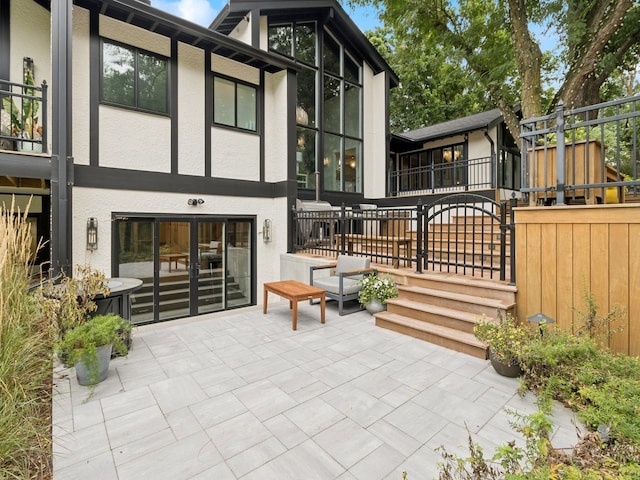 back of property with french doors and a patio