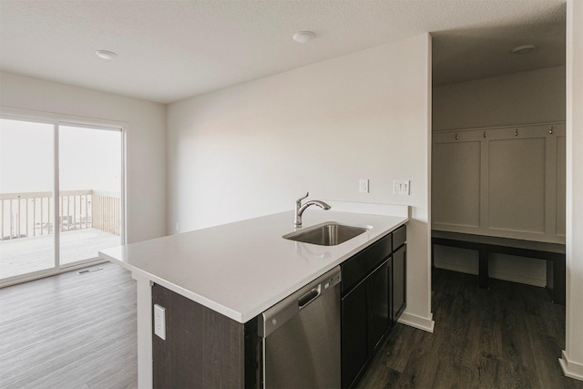 kitchen featuring kitchen peninsula, dishwasher, and sink