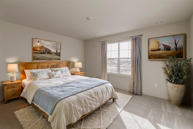 bedroom with light colored carpet