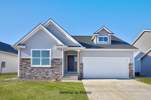 craftsman-style house with a garage and a front yard