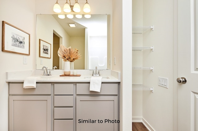 bathroom featuring vanity and hardwood / wood-style flooring