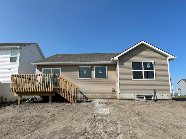 rear view of house with a wooden deck