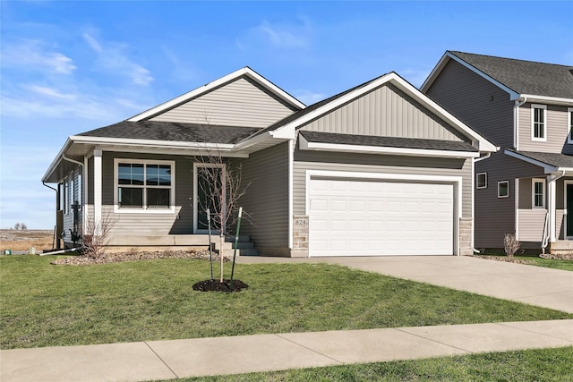 view of front of home featuring a garage and a front lawn