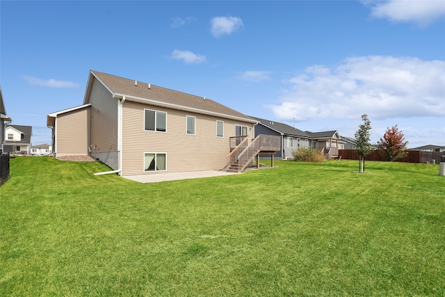 rear view of property with a yard