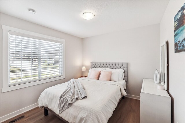 bedroom featuring dark wood-type flooring