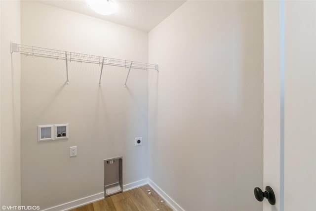 1109 Mulberry Dr NW, Bondurant, IA 50035 - clothes washing area with hookup for an electric dryer, light wood-style floors, baseboards, laundry area, and washer hookup