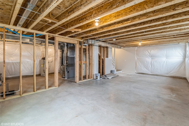 basement with heating unit and water heater