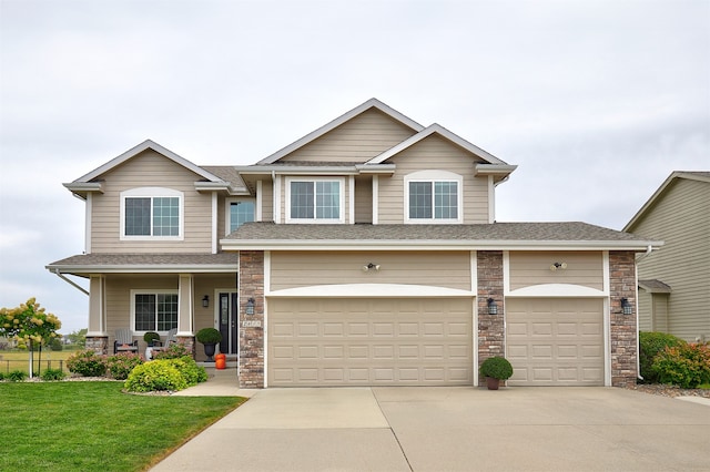 craftsman-style home with a garage and a front yard