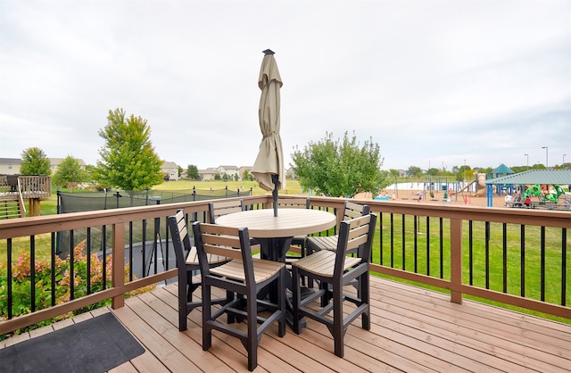 wooden terrace with a yard