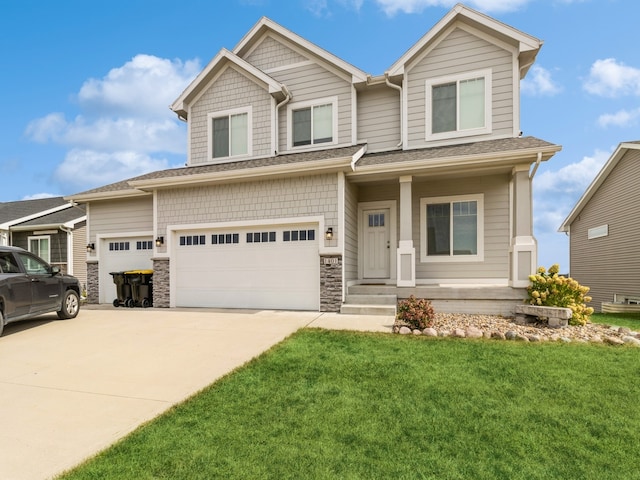 view of front of house with a garage and a front yard