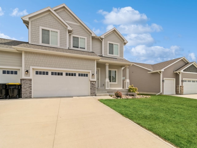 craftsman-style house with a garage and a front yard