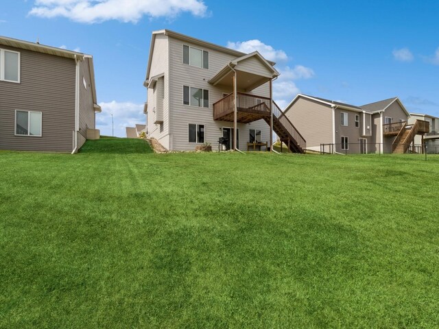 1401 S 10th St, Adel, IA 50003 - back of property featuring stairs, a wooden deck, and a yard