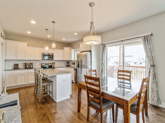1401 S 10th St, Adel, IA 50003 - dining area with wood finished floors and recessed lighting