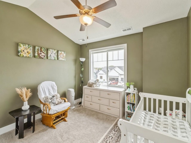 1401 S 10th St, Adel, IA 50003 - bedroom with a nursery area, lofted ceiling, light carpet, a ceiling fan, and baseboards