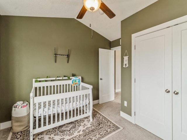 1401 S 10th St, Adel, IA 50003 - bedroom with carpet flooring, lofted ceiling, a crib, baseboards, and a ceiling fan