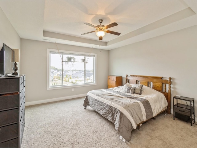 1401 S 10th St, Adel, IA 50003 - bedroom with a tray ceiling, light carpet, baseboards, and ceiling fan
