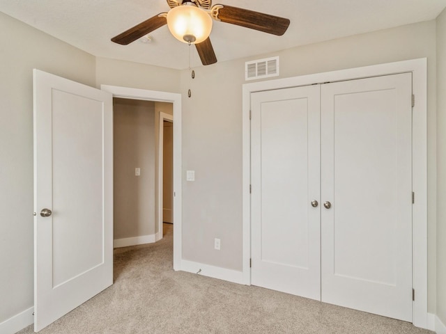 1401 S 10th St, Adel, IA 50003 - unfurnished bedroom with light colored carpet, baseboards, a closet, and ceiling fan