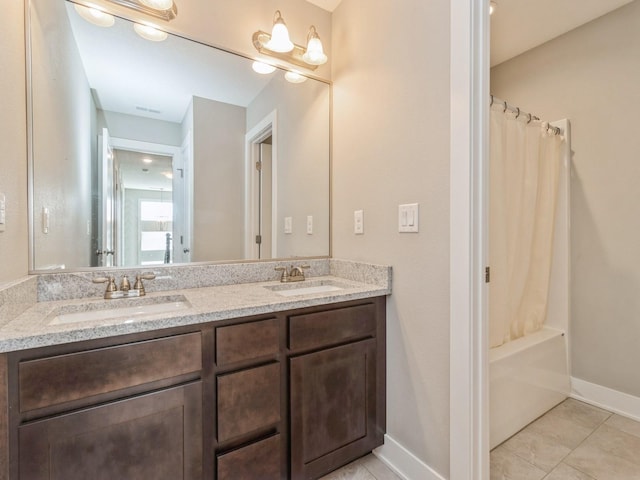 1401 S 10th St, Adel, IA 50003 - full bathroom featuring double vanity, tile patterned floors, baseboards, and shower / bath combo