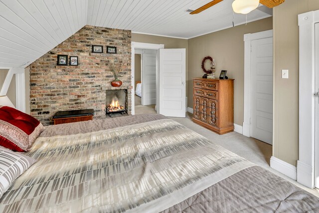 bedroom featuring ceiling fan, light colored carpet, wood ceiling, and vaulted ceiling