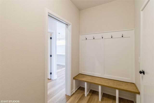 mudroom with light hardwood / wood-style floors