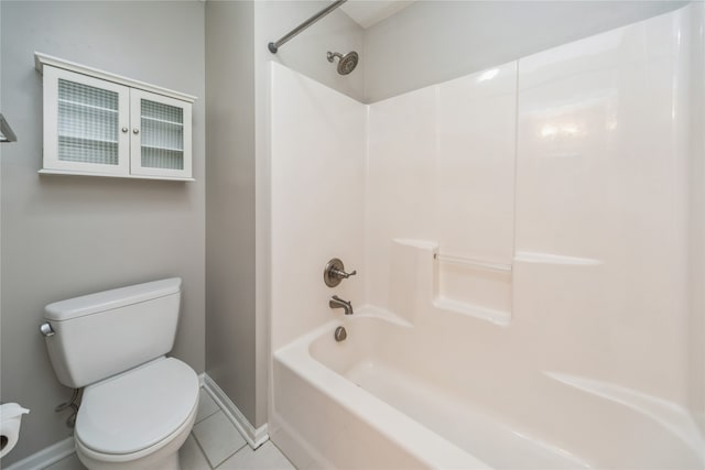 bathroom featuring toilet, shower / tub combination, and tile patterned floors