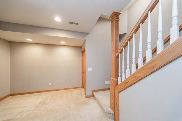 interior space featuring light carpet