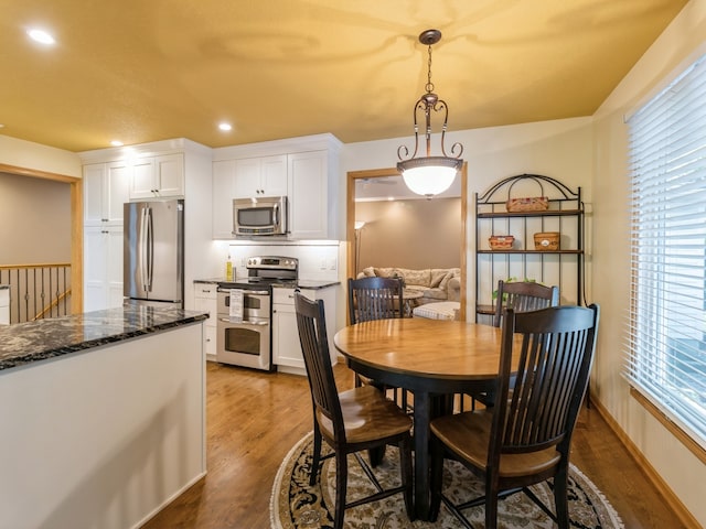 dining area featuring dark hardwood / wood-style floors