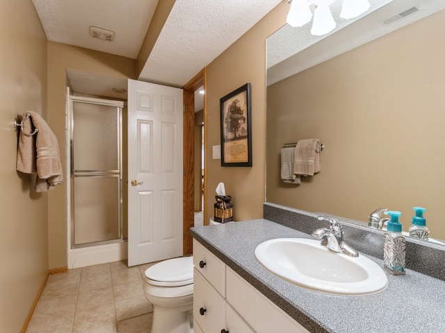 bathroom with vanity, toilet, an enclosed shower, and tile patterned floors