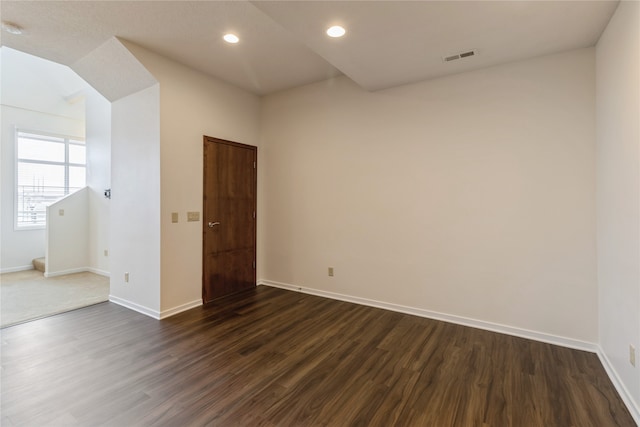 empty room featuring dark wood-type flooring