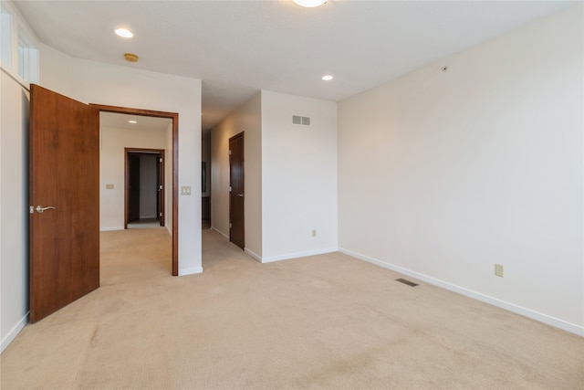 empty room with light colored carpet