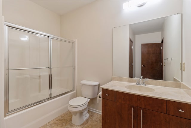 full bathroom with tile patterned floors, vanity, toilet, and enclosed tub / shower combo