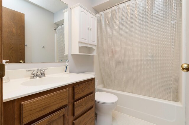 full bathroom with shower / tub combo, vanity, and toilet