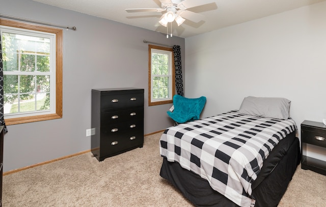 bedroom featuring ceiling fan and light colored carpet