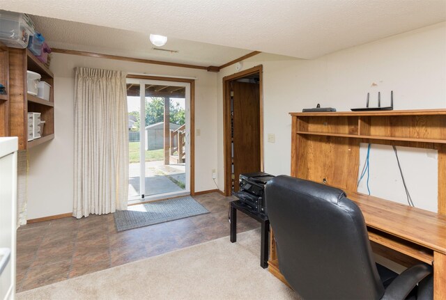 carpeted office space featuring a textured ceiling and crown molding