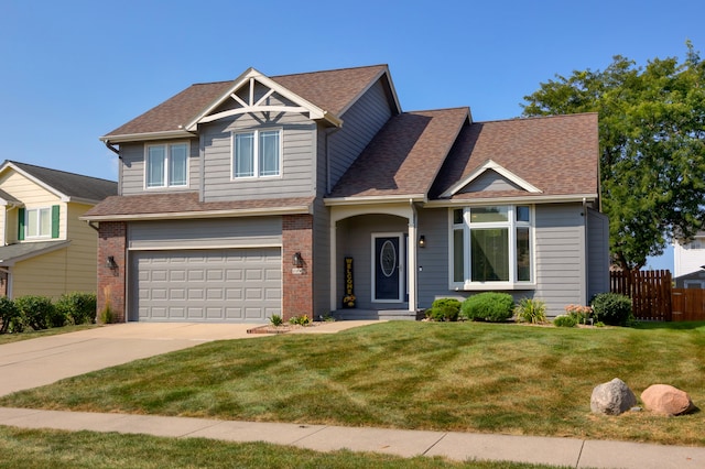 view of front of property featuring a front yard and a garage