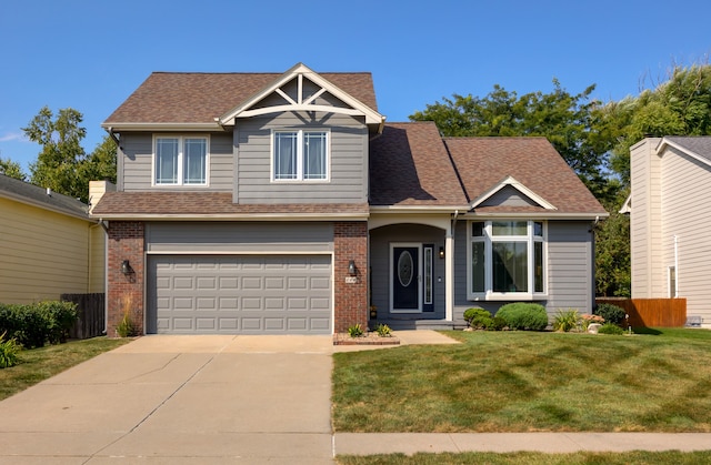 view of front of property with a front yard and a garage