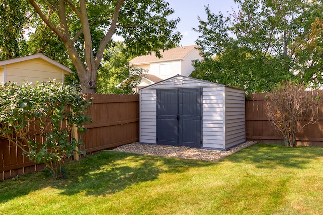 view of outbuilding featuring a yard