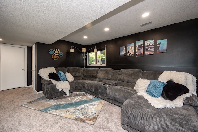 carpeted living room featuring a textured ceiling