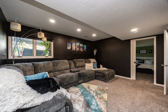 carpeted living room with a textured ceiling