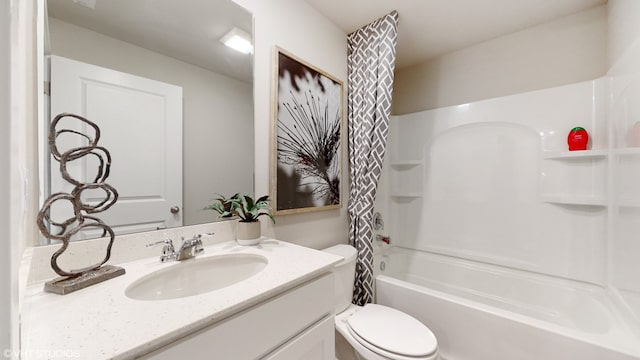 full bathroom featuring shower / bath combo with shower curtain, vanity, and toilet