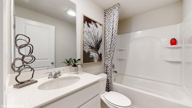 2527 E 47th St, Des Moines, IA 50317 - full bathroom with toilet, vanity, and shower / bath combo with shower curtain