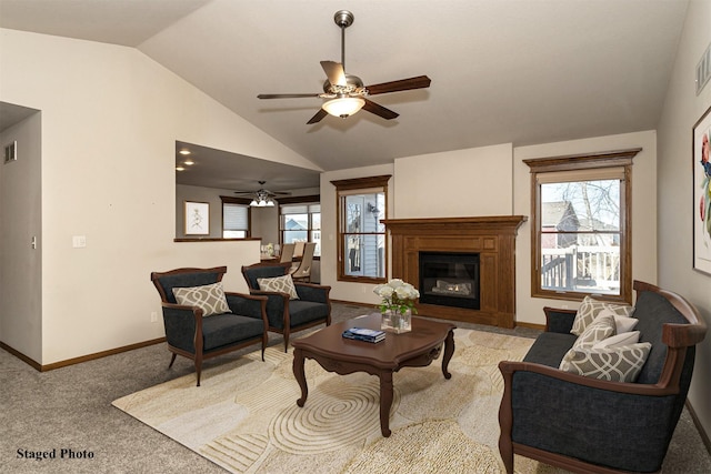 living room featuring ceiling fan, light colored carpet, and vaulted ceiling