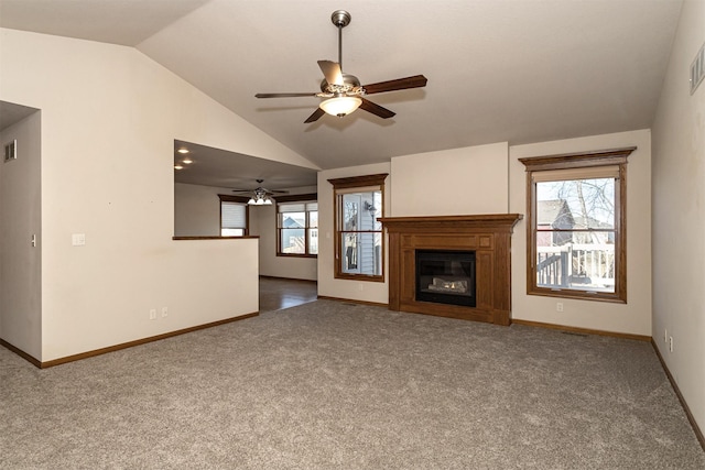 unfurnished living room featuring lofted ceiling, carpet floors, and ceiling fan